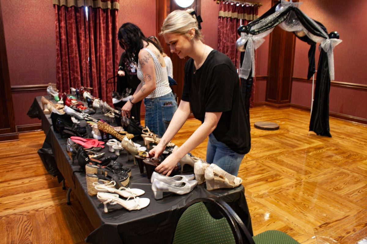 Kassidy Pameticky and Maddyson McMorris sort donations for the annual Prom Boutique.